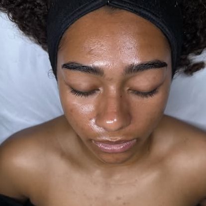 A client relaxing during a glow-focused facial at the studio
