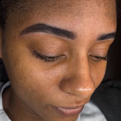 Sculpted brows and lifted lashes framing the eyes