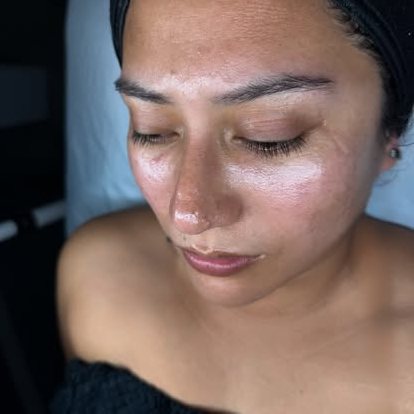 Brow lamination in progress during a brow artistry session